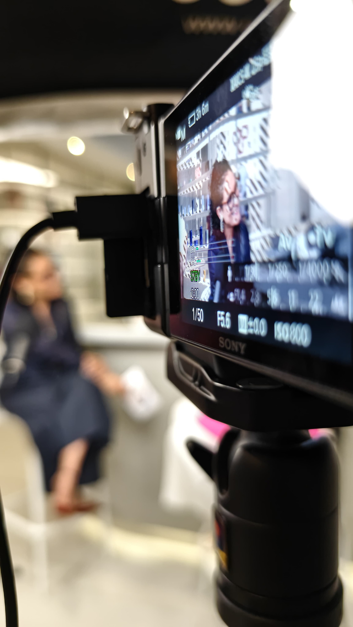 Tanvi on a production monitor during filming